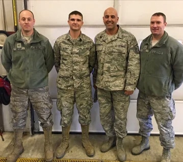 4 men in army uniforms