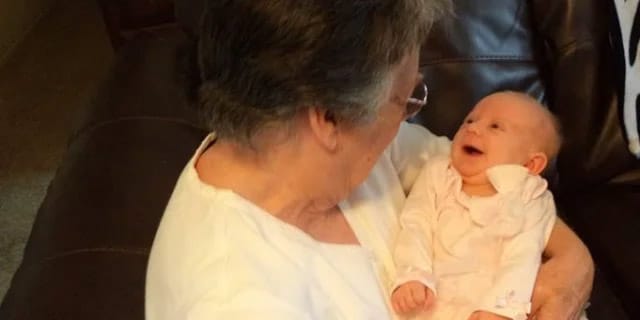 grandma holding a baby